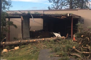 One of the fallen trees just missed landing on the clubhouse at Downriver GC. 