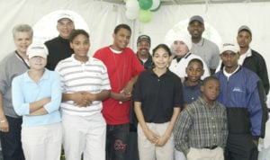 Bill Wright (back row, second from left; with wife Ceta) returned to Jefferson Park GC in 2009 for “Bill Wright Day,” conducting a clinic for current members of the Fir State Junior Golf program (pictured) where he got started in the game in the 1950s. 