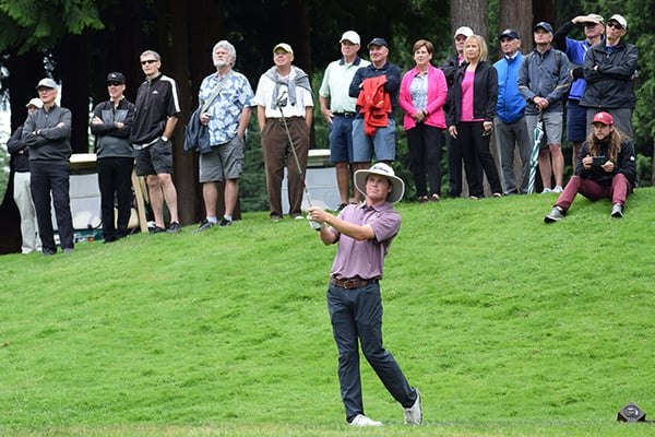 Joe Highsmith hits a shot during the final round of the Sahalee Players championship as a crowd looks on.