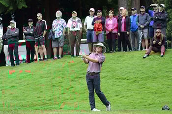 Joe Highsmith hits a shot during the final round of the Sahalee Players championship as a crowd looks on.