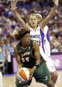 Sheri Sam playing basketball