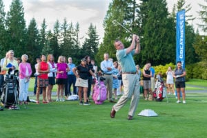 A hands-on guy, Mike Whan shows his game by hitting a shot during a contest at the range at Sahalee Country Club prior to the 2016 KPMG Women’s PGA Championship. (Photo by Rob Perry)
