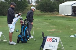Michael Greller stands on the range with Jordan Spieth's swing coach
