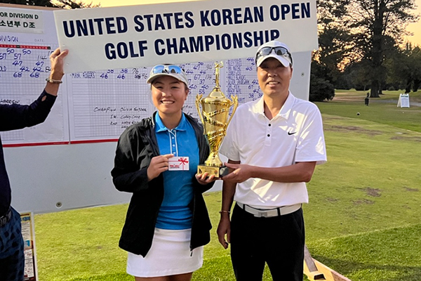 Father and son carry Alpha Trophy into the future