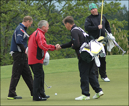 Sandy Harper (red jacket) of BC Golf is congratulated by Scott Hval of OGA, as Tom Brandes and Mike Haack of WSGA look on.