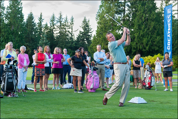Michael Whan shows his game by hitting a shot during a contest at the range at Sahalee following the press conference at the Kick-Off event.  (Photo by Rob Perry) 