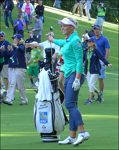 Brooke Henderson heard the roars after she stuck her second shot on the playoff hole to within three feet, to secure the victory.