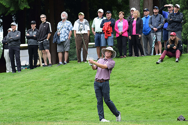 Joe Highsmith hits a shot during the final round of the Sahalee Players championship as a crowd looks on.