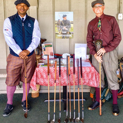 Durel Billy stands by hickory golf club exhibit
