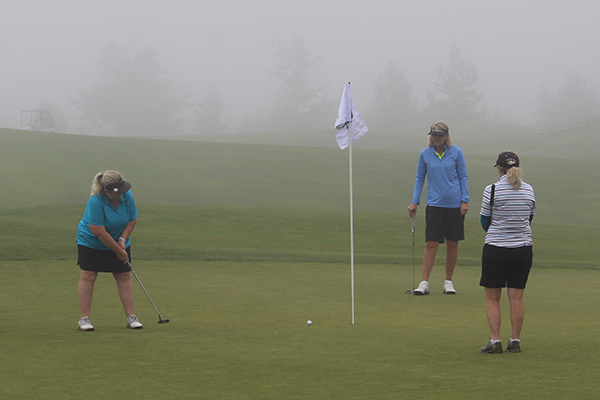 Players battled through foggy conditions during Thursday's opening round.